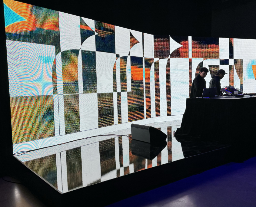 Operators running content on a curved LED video wall