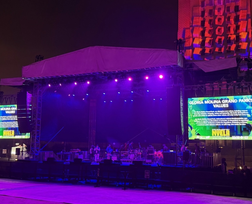 Outdoor concert stage with twin LED screens in downtown Los Angeles